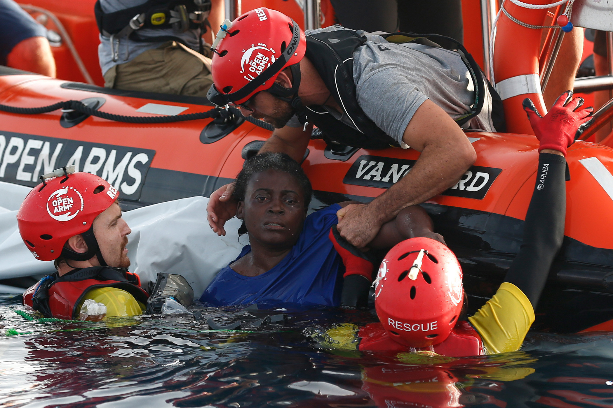 Miles off. A migrant is Rescued by members of the Spanish ngo. Rescue Arm usar.