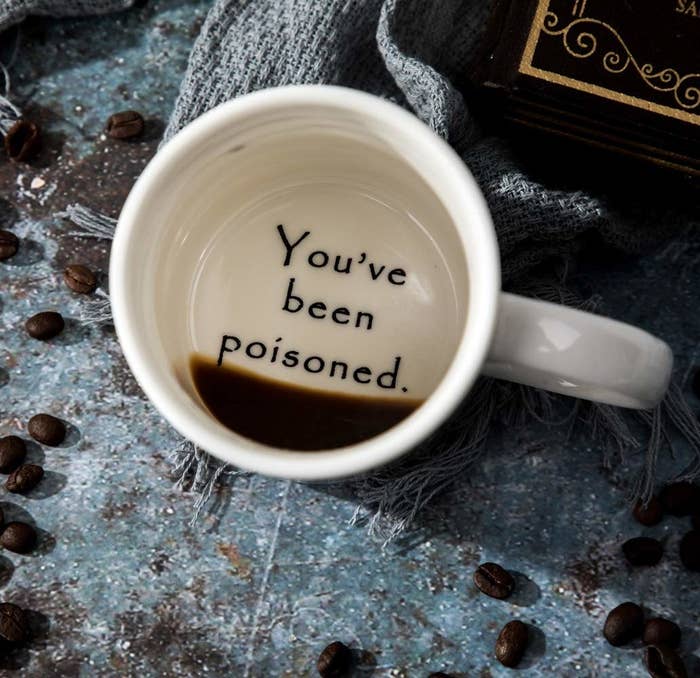 the bottom of the coffee mug, which says &quot;You&#x27;ve been poisoned&quot;