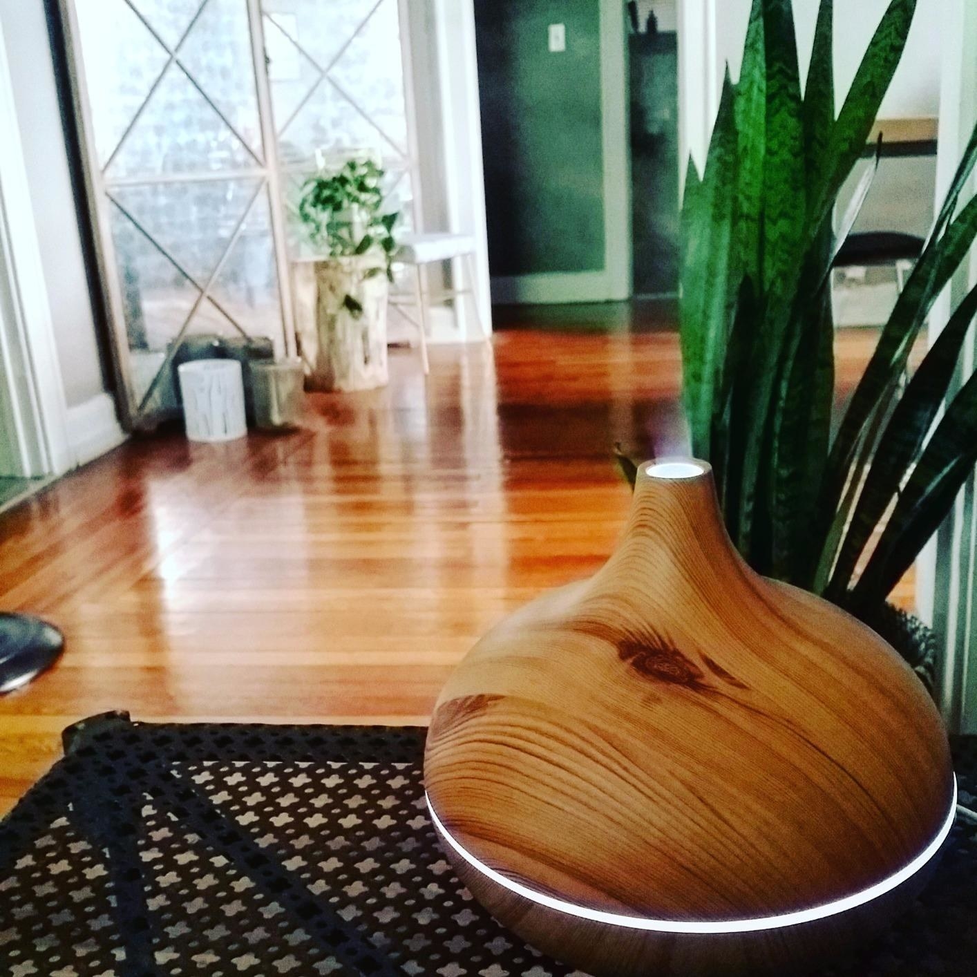 A reviewer&#x27;s photo of the rounded diffuser, with vapor coming out of the top