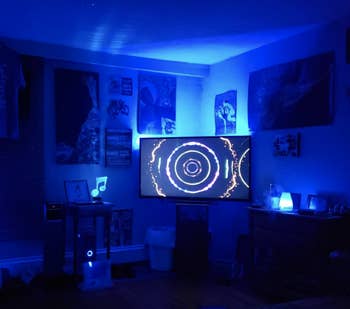 a reviewer's tv with glowing blue lights behind it