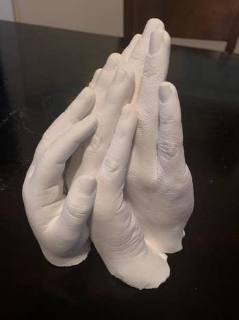 reviewer photo of three cast hands