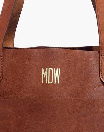 a close up of the gold monogram letters on the bag