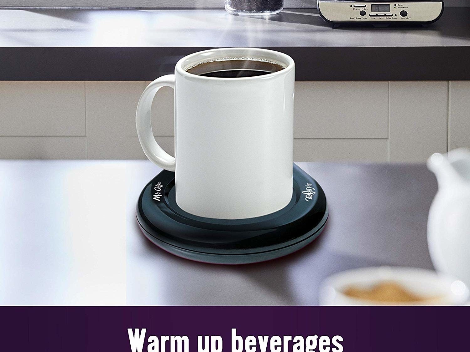 A mug filled with coffee placed on the warmer 