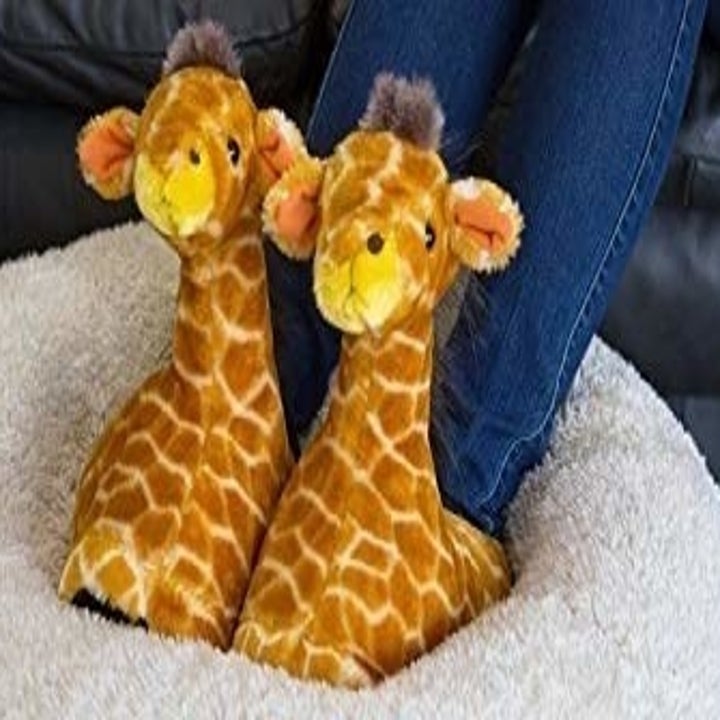 A model wearing the giraffe slippers