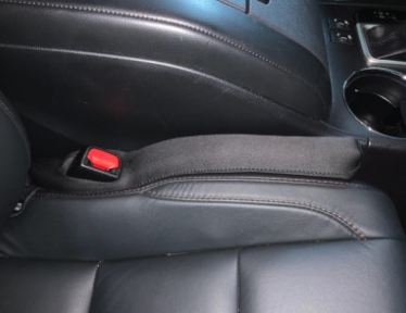 a reviewer&#x27;s car with the seat gap filler in it 