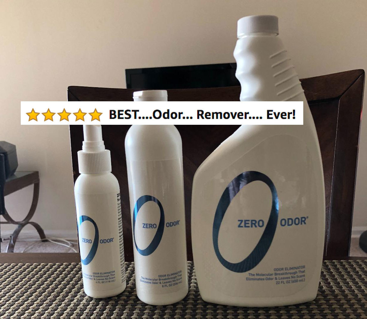 A reviewer showing the product in three differently sized bottles