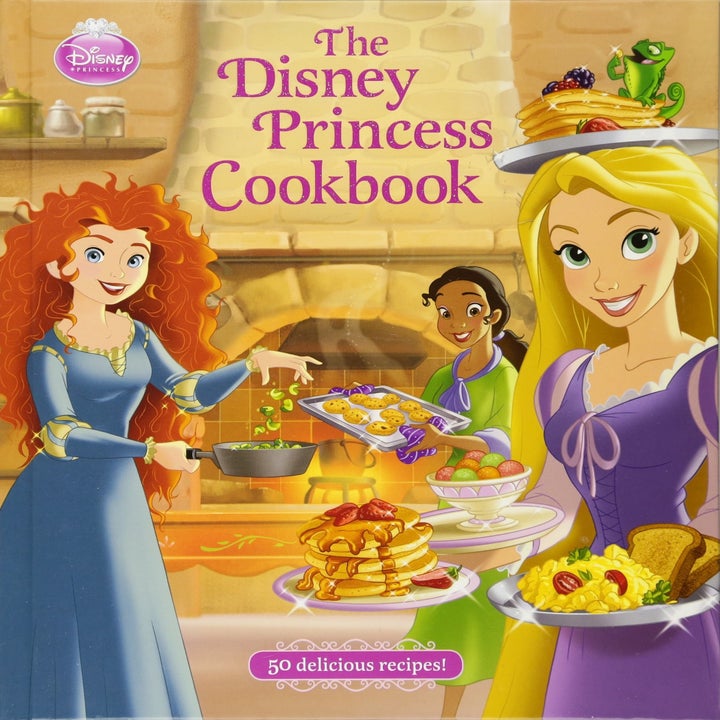 the disney princess cook book with merida, rapunzel, and tiana on the cover