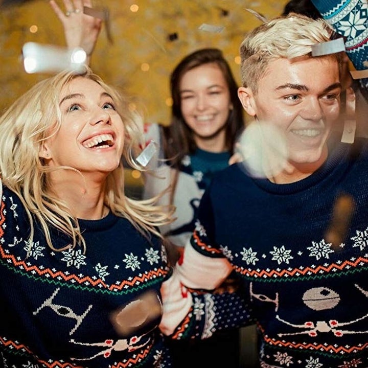 a group of people wearing the sweater