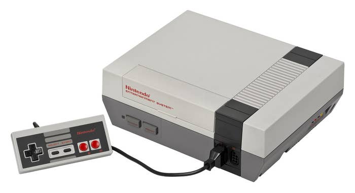 A Nintendo with one controller on a white background