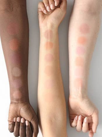 cloud paint swatches on three different skin tones
