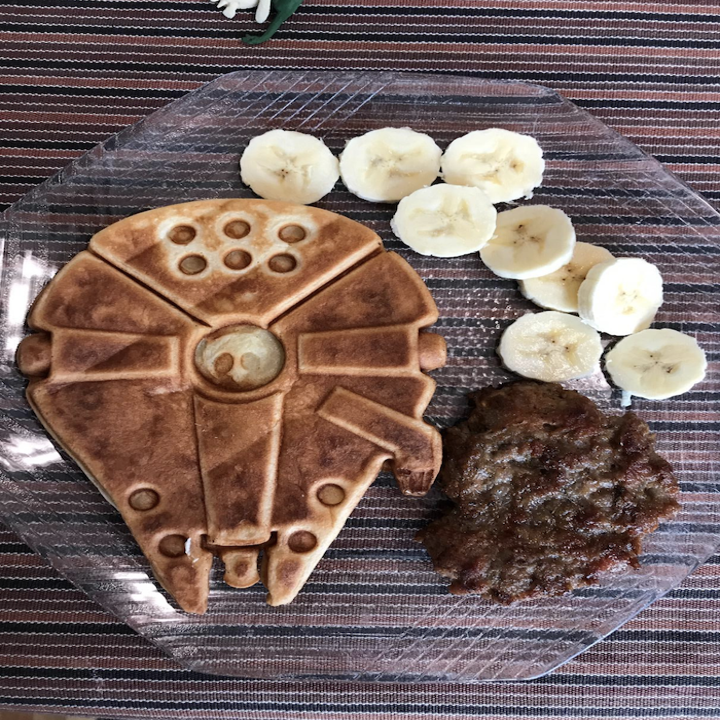 the falcon waffle with banana slices on a plate beside it