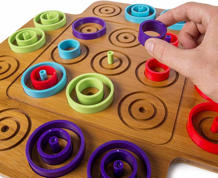 concentric circle pieces on otrio&#x27;s wooden board