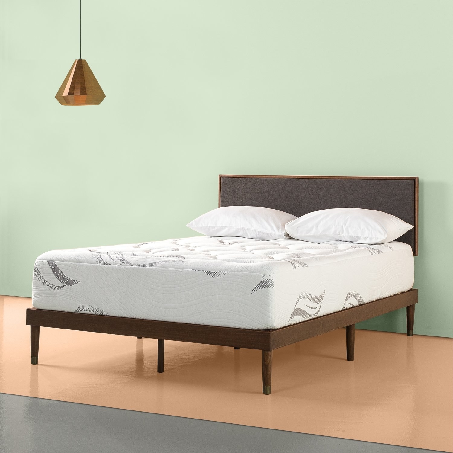 a dense mattress on a simple bedframe