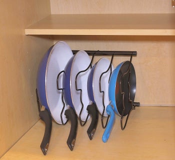 the rack lying on its side with the pans inserted on their sides