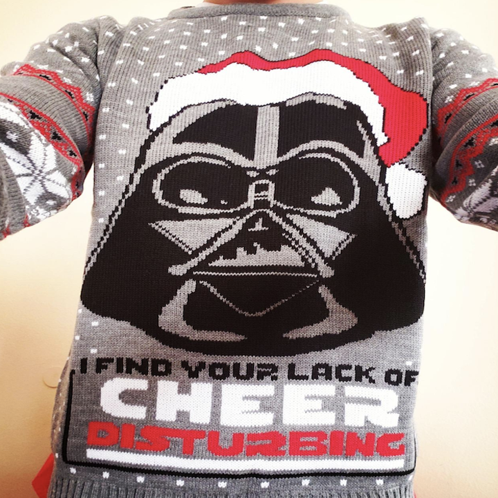 close-up of the sweater which says, "I find your lack of cheer disturbing"