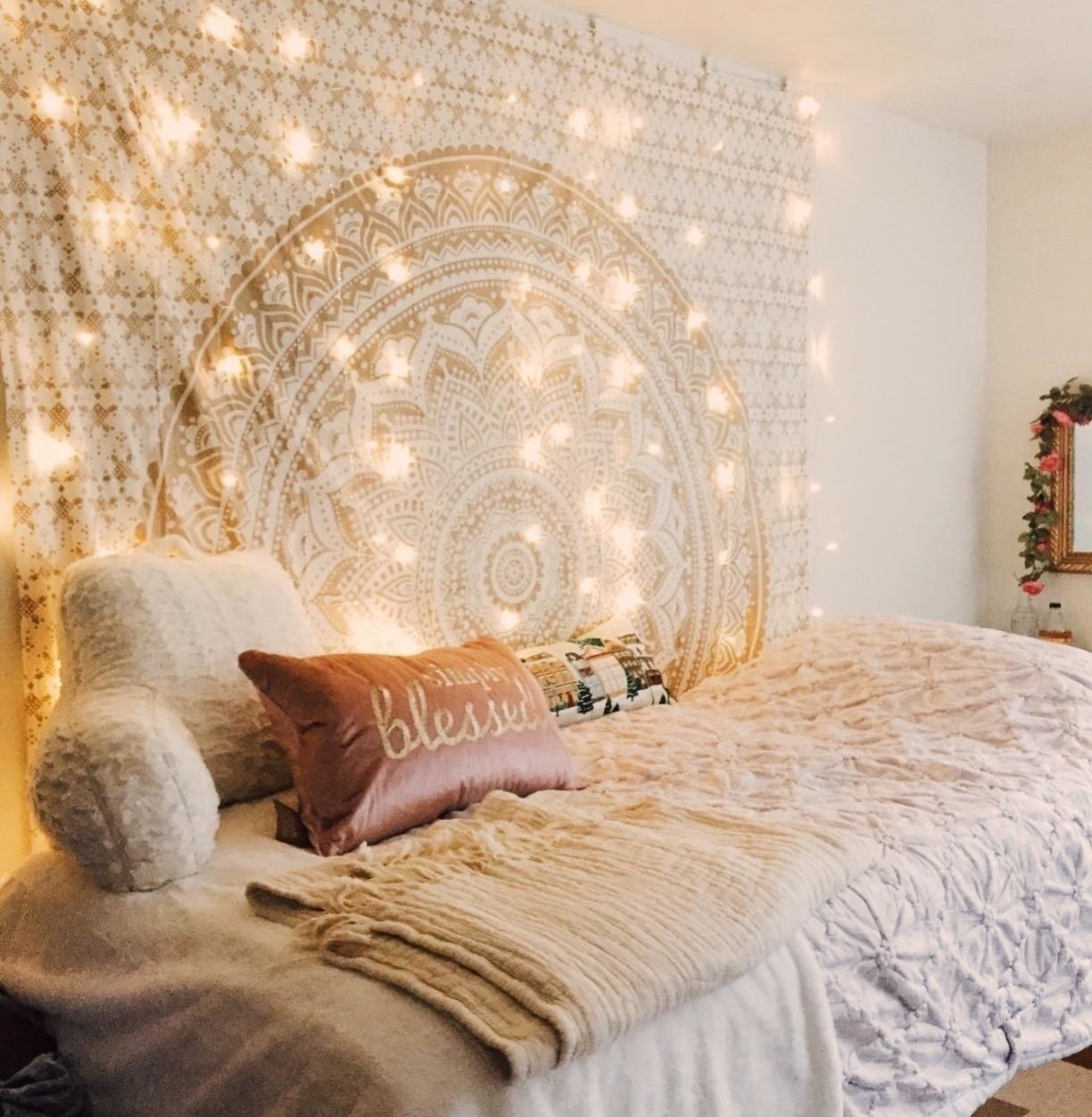 reviewer&#x27;s twinkle lights above their bed 