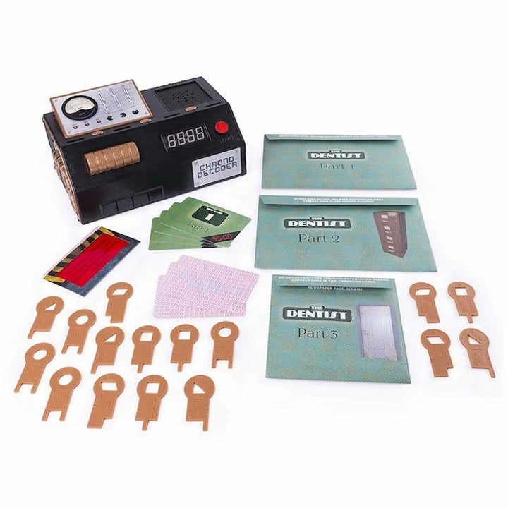 the contents of the escape room game including lots of different direction cards

