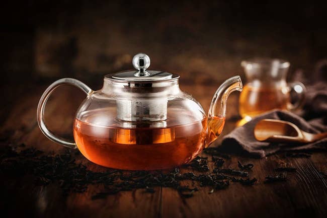 The teapot and diffuser filled with tea