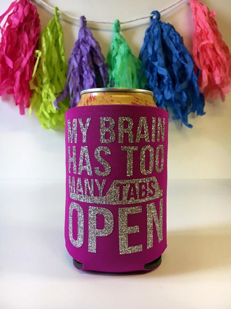 pink coozie with silver glitter on it that says &quot;my brain has too many tabs open&quot; 