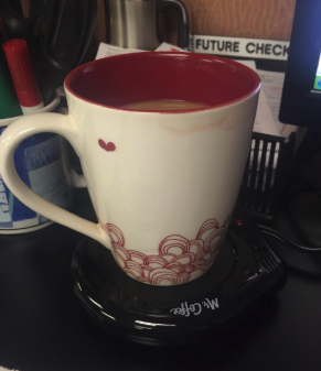 a reviewer's mug on the warmer