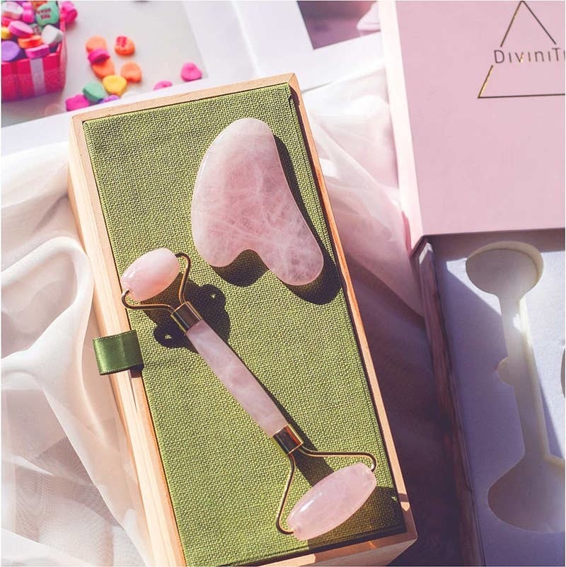 The rose quartz roller with a small and big roller on each end and and a Gua Sha with a blob-like shape