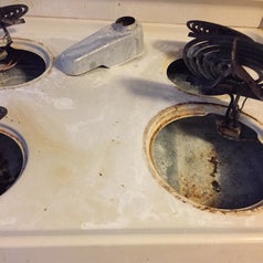 reviewer's stovetop full of grime and build-up 