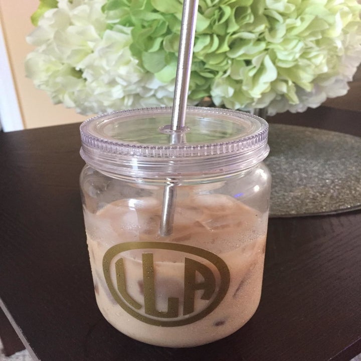 A reviewer showing their cup of iced coffee