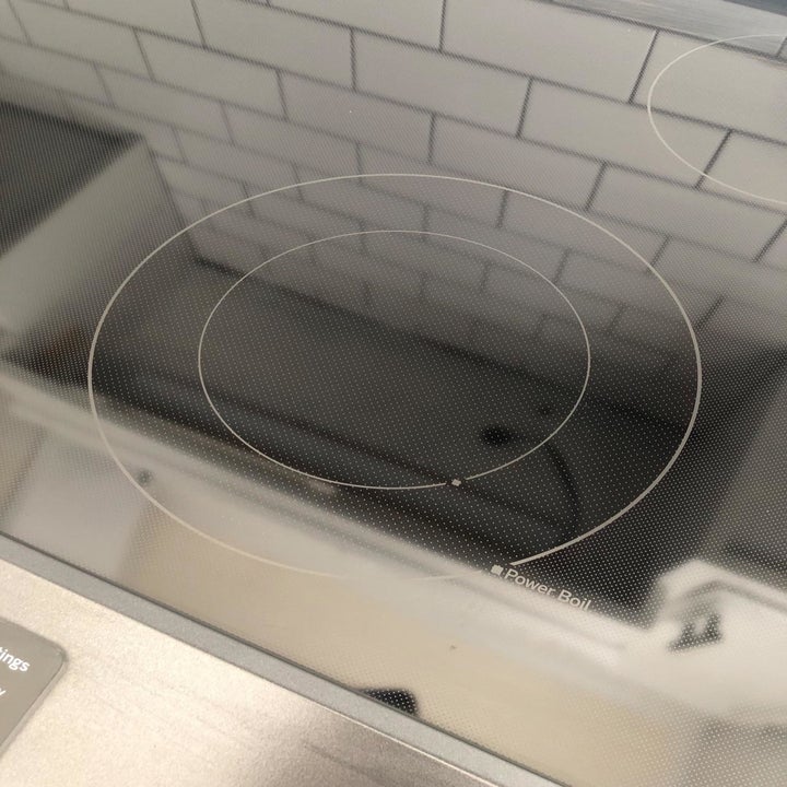 the same stovetop without any stains, looking very clean and shiny 