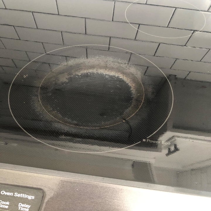 reviewer's ceramic stovetop with stains on it 