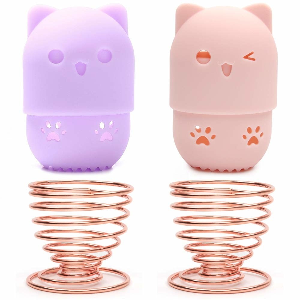 two spiral makeup sponge holders and two cat-style holders