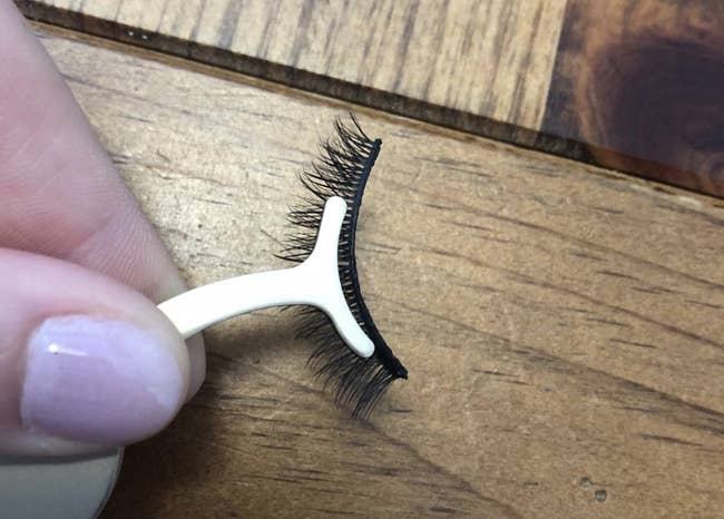 reviewer image of clamps holding fake eyelashes