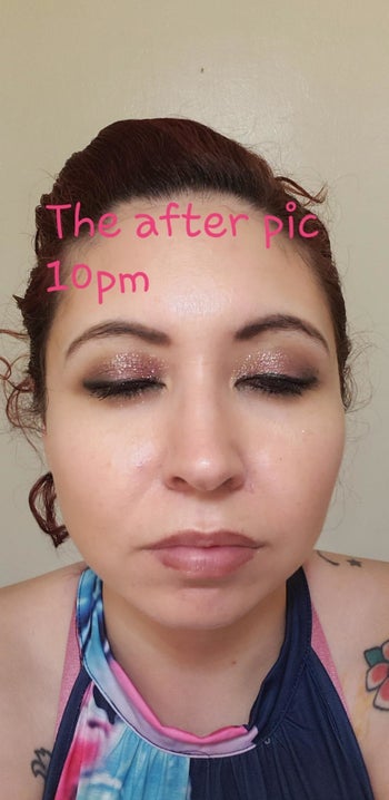 The same reviewer with their eyes closed and makeup still intact with text that reads 