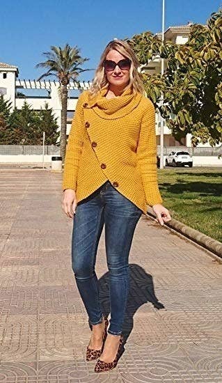 a model in the sweater in mustard yellow