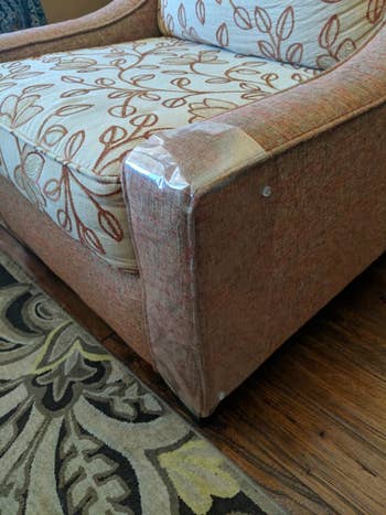 Reviewer photo of the clear protector wrapped around the base of an armchair