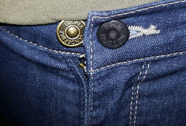 reviewer image close up of the button extender, showing how it adds extra to the waistline