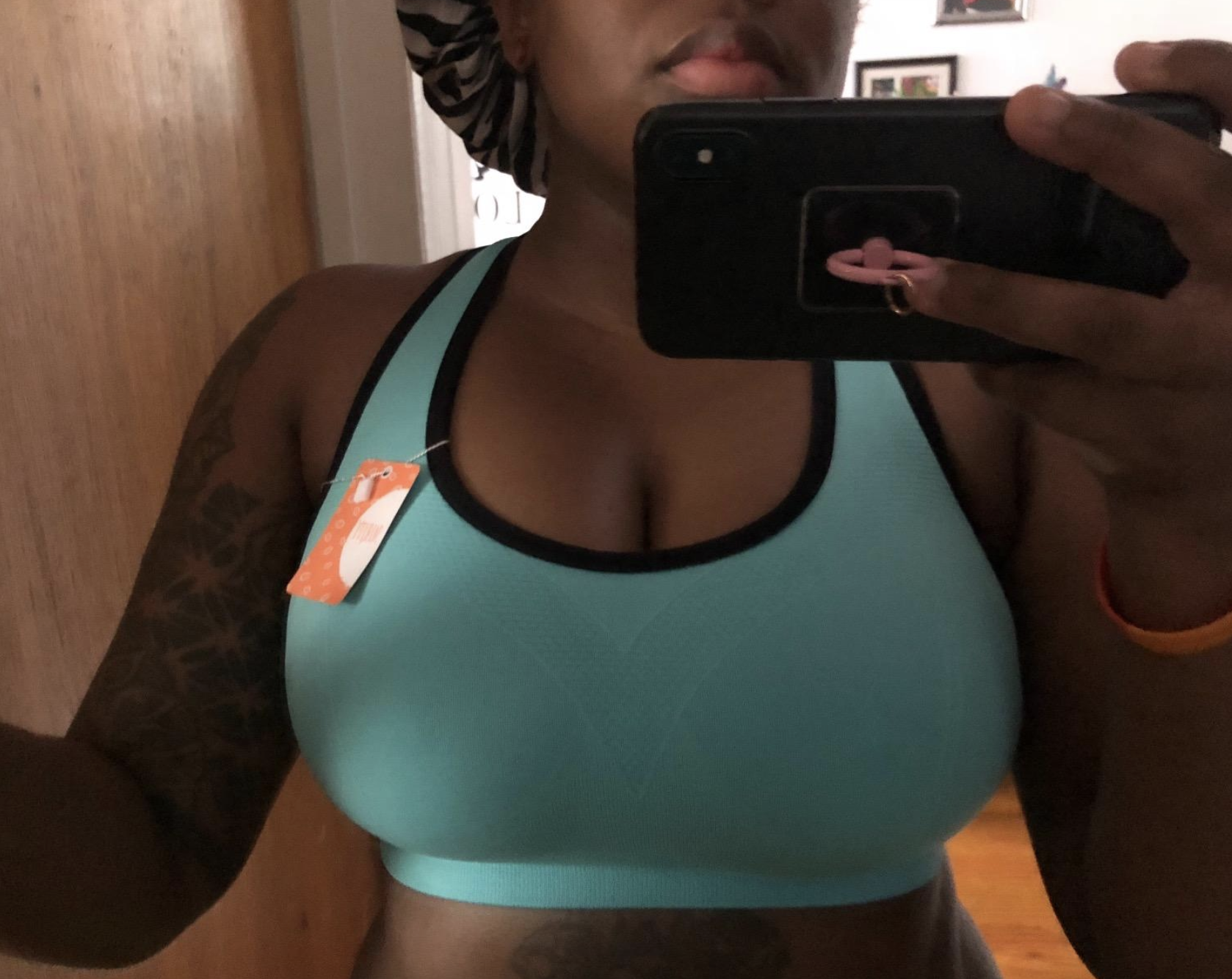 reviewer wearing the sports bra in light blue