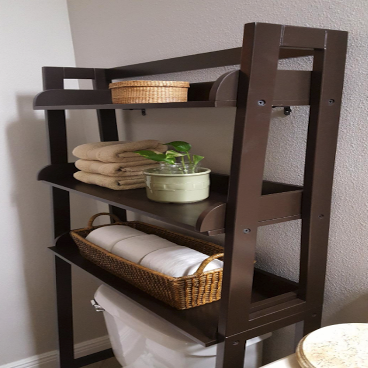 the brown wood version with toilet paper, towels, and a small plant