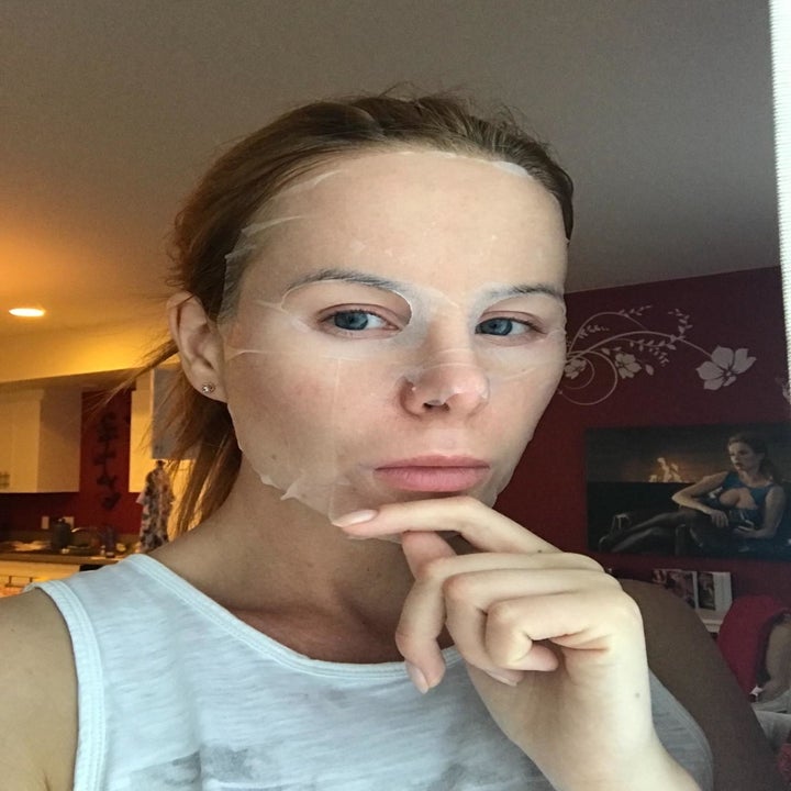 A reviewer wearing the thin sheet mask