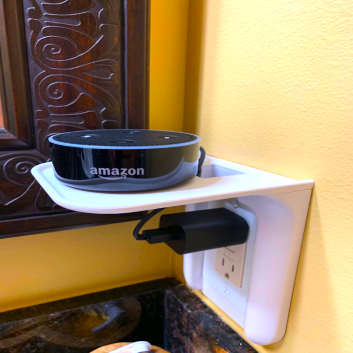 the power perch which fits over a reviewer's bathroom socket and has a ledge that sticks out so an Amazon Echo Dot sits on it