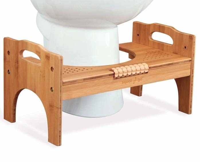 the wooden squatting tool which looks like a bench but has a curved opening so it can fit around the base of a toilet
