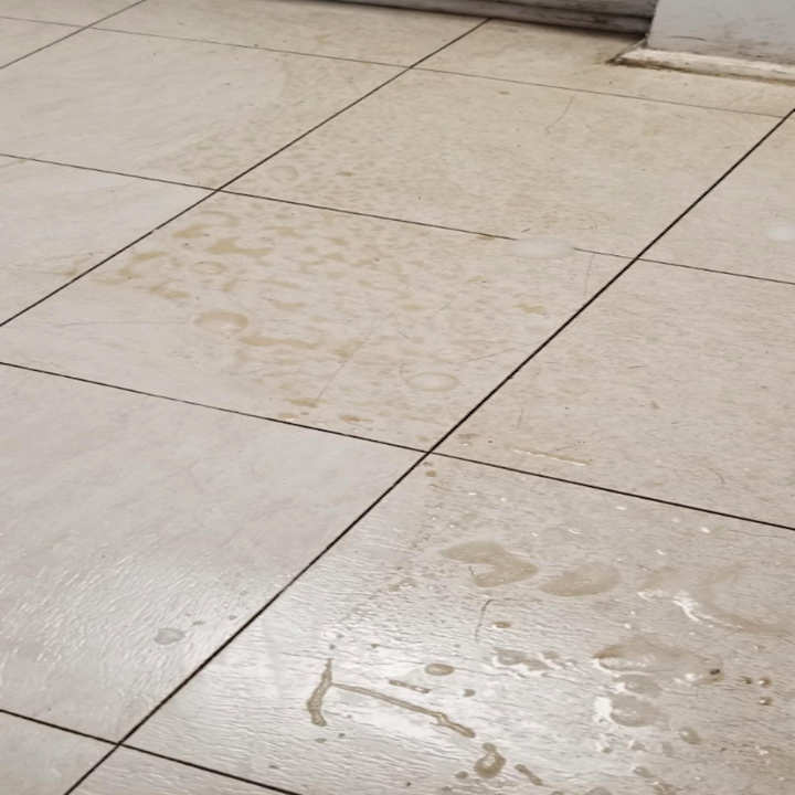 reviewer's dirty white tiled floor 