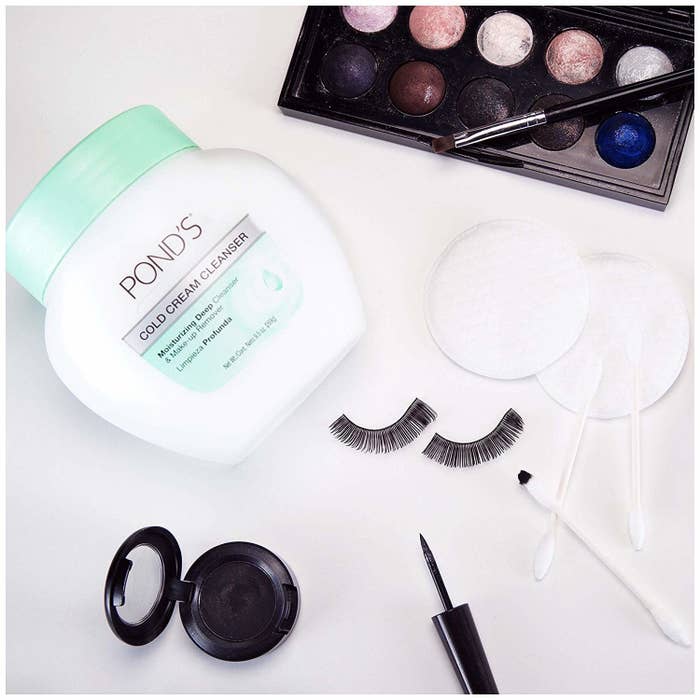 the Pond&#x27;s cold cream cleaners with various makeup bag essentials