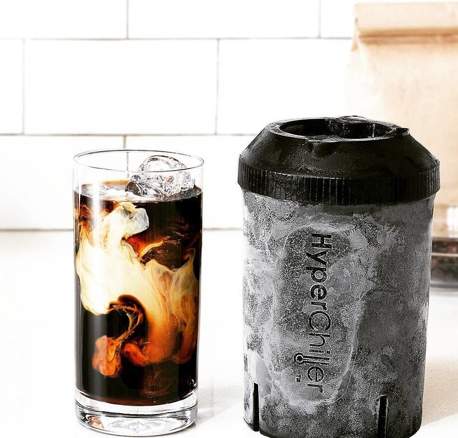 black and gray HyperChiller next to a glass of iced coffee