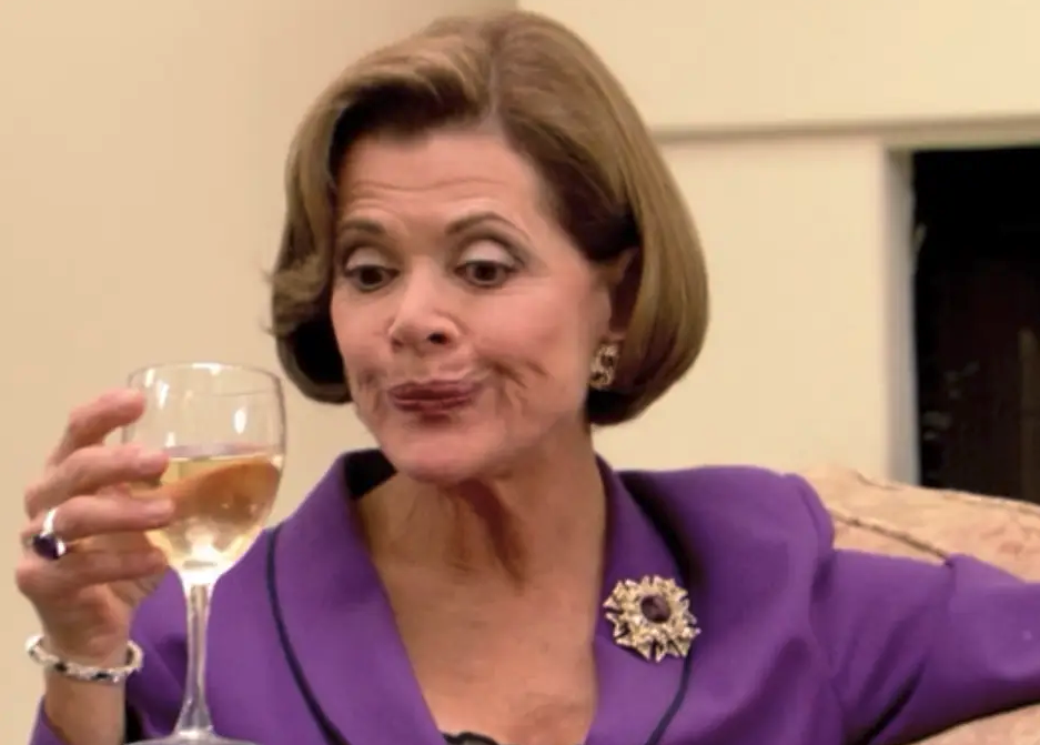 Lucille Bluth sipping wine