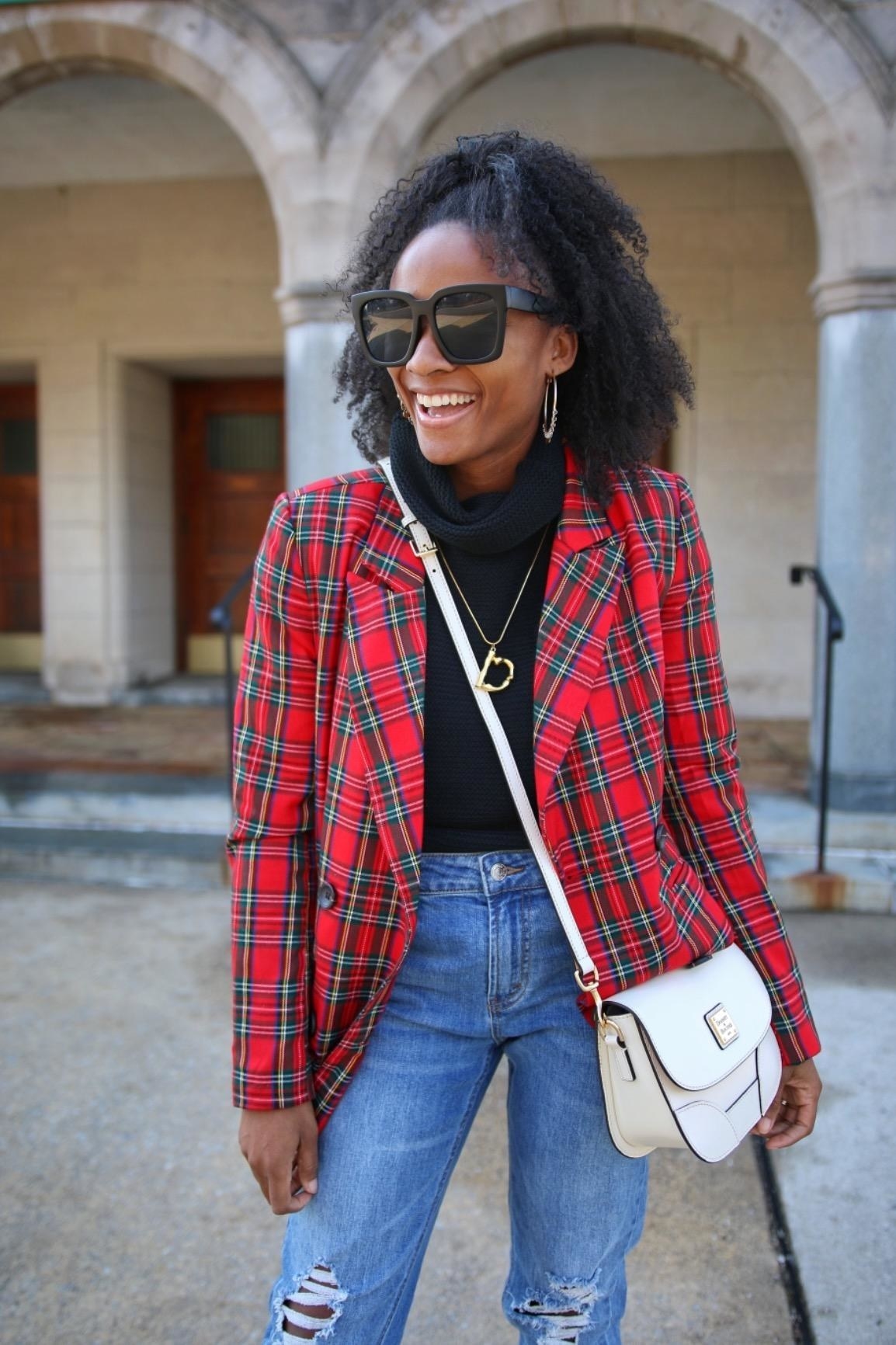 Reviewer wearing the blazer in red and green plaid print