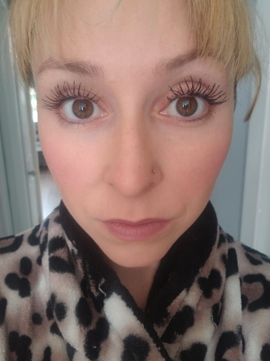 reviewer wearing the mascara showing off very long lashes that span out properly
