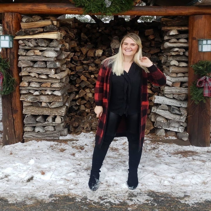 Reviewer wearing the leggings with a leather-like look to them