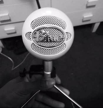 a reviewer photo of the microphone in white