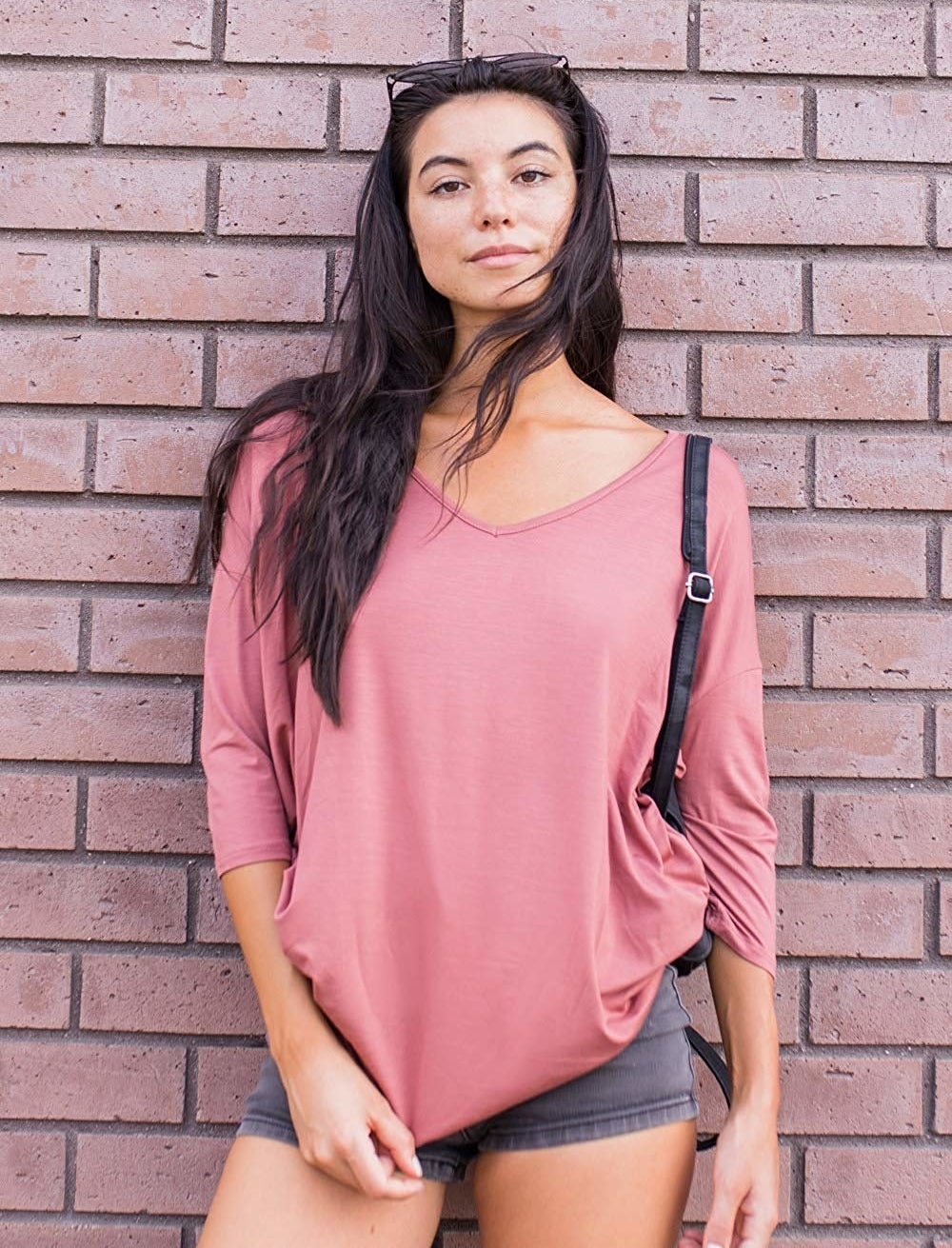 model wearing the sleeved top in pink 