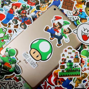 a bunch of mario themed stickers 
